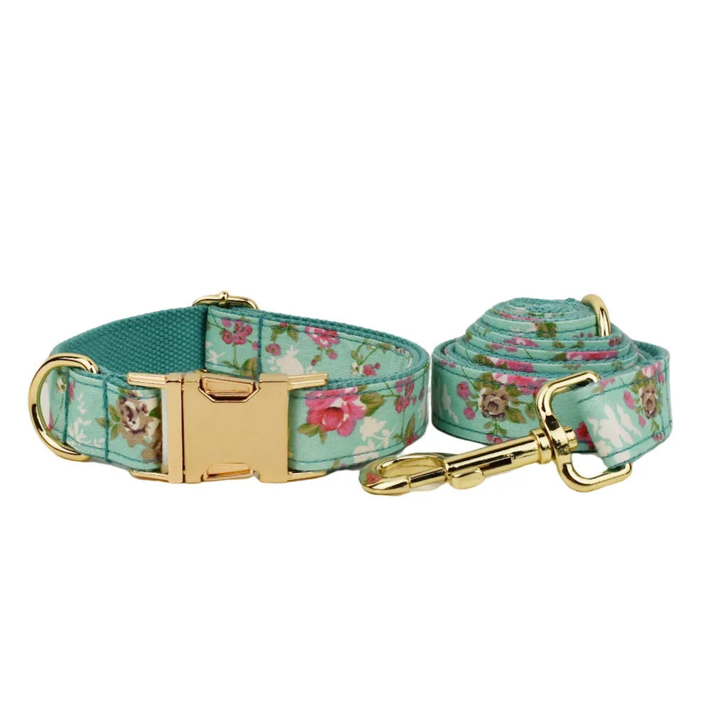 Rose pattern dog collar set with green background including collar, leash, and detachable bow
