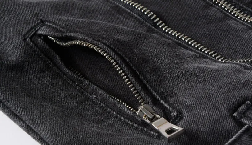 Black slim-fit linen denim jacket with lapel collar and front zipper placket on plain background
