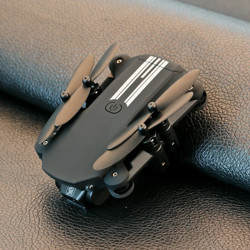 Mini folding drone with 4K camera and foldable arms in black plastic and metal construction