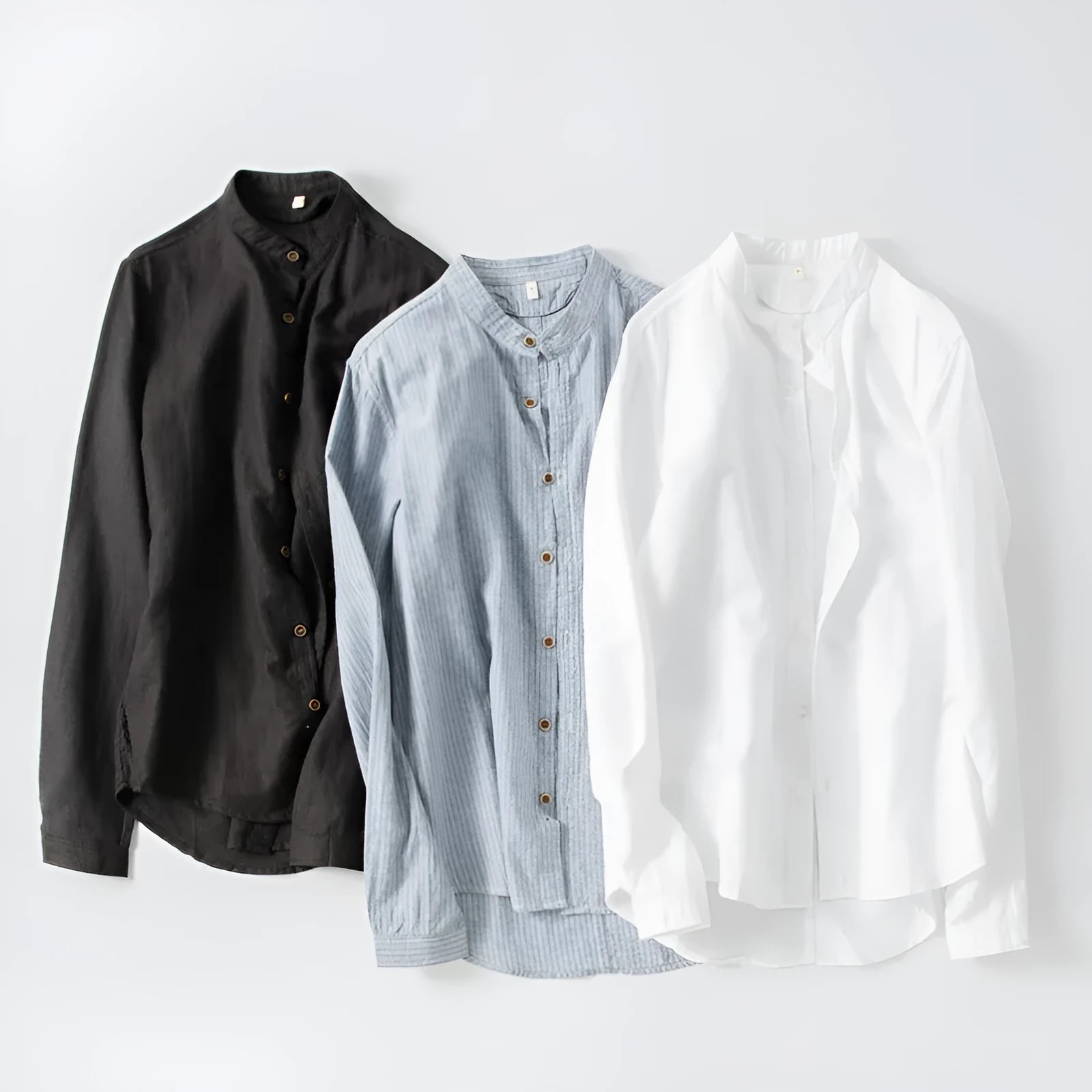 White long sleeve cotton shirt with classic fit, collared neckline, and button front