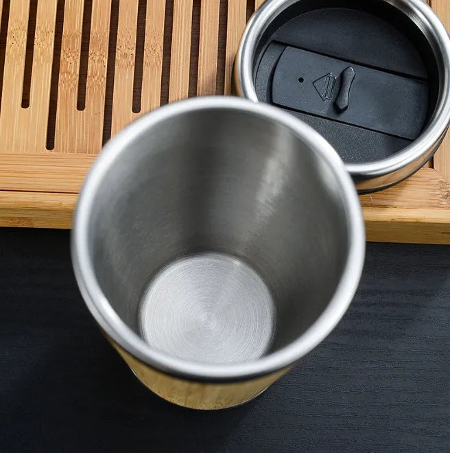 Bamboo coffee cup with double wall insulation, leak-proof lid, and anti-slip foam pad base