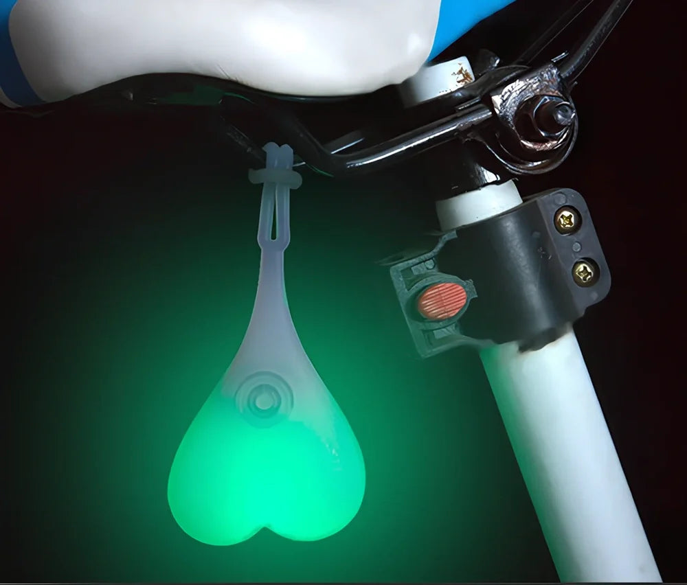 Blue beating heart silicone bike rear light, 15 cm long, touch-activated and waterproof for night cycling safety