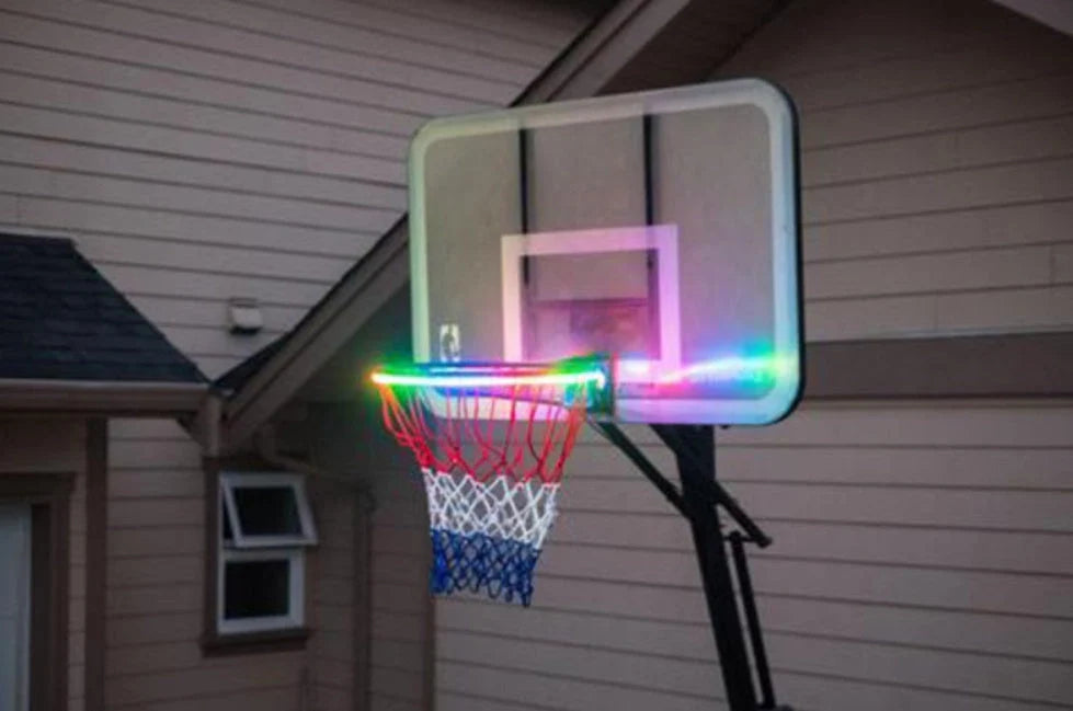 Induction Color Changing Basketball Frame Light attached to a basketball rim, illuminating at night