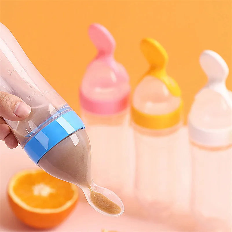 Pack of 12 clear plastic disposable champagne flutes in assorted colours on a table.