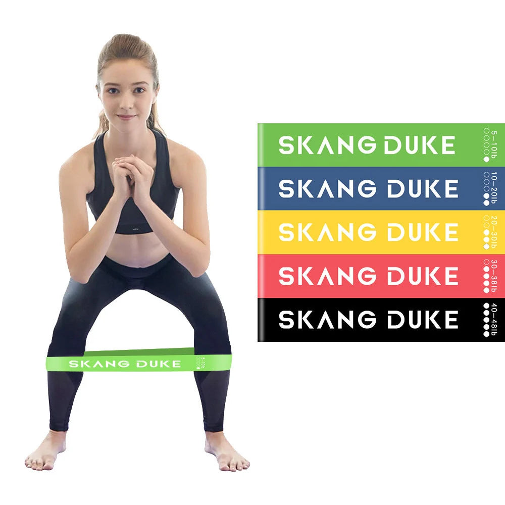 Set of five colour-coded resistance bands for yoga and fitness training, with storage bag