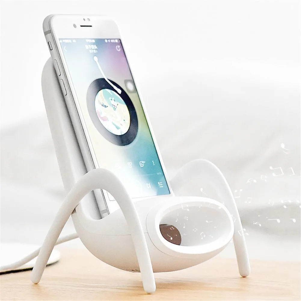 White mini chair shaped wireless charging stand for smartphones on desk