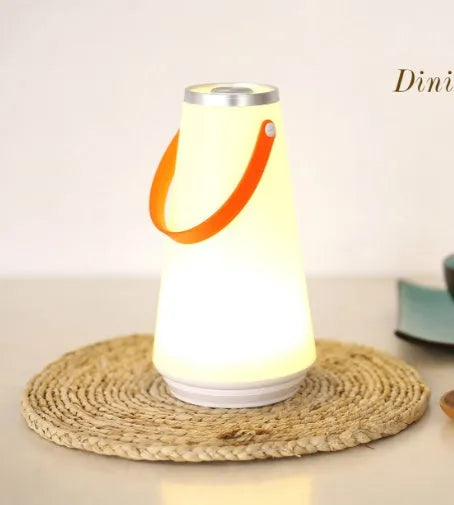 White rechargeable LED bedside lamp with warm light and adjustable brightness settings