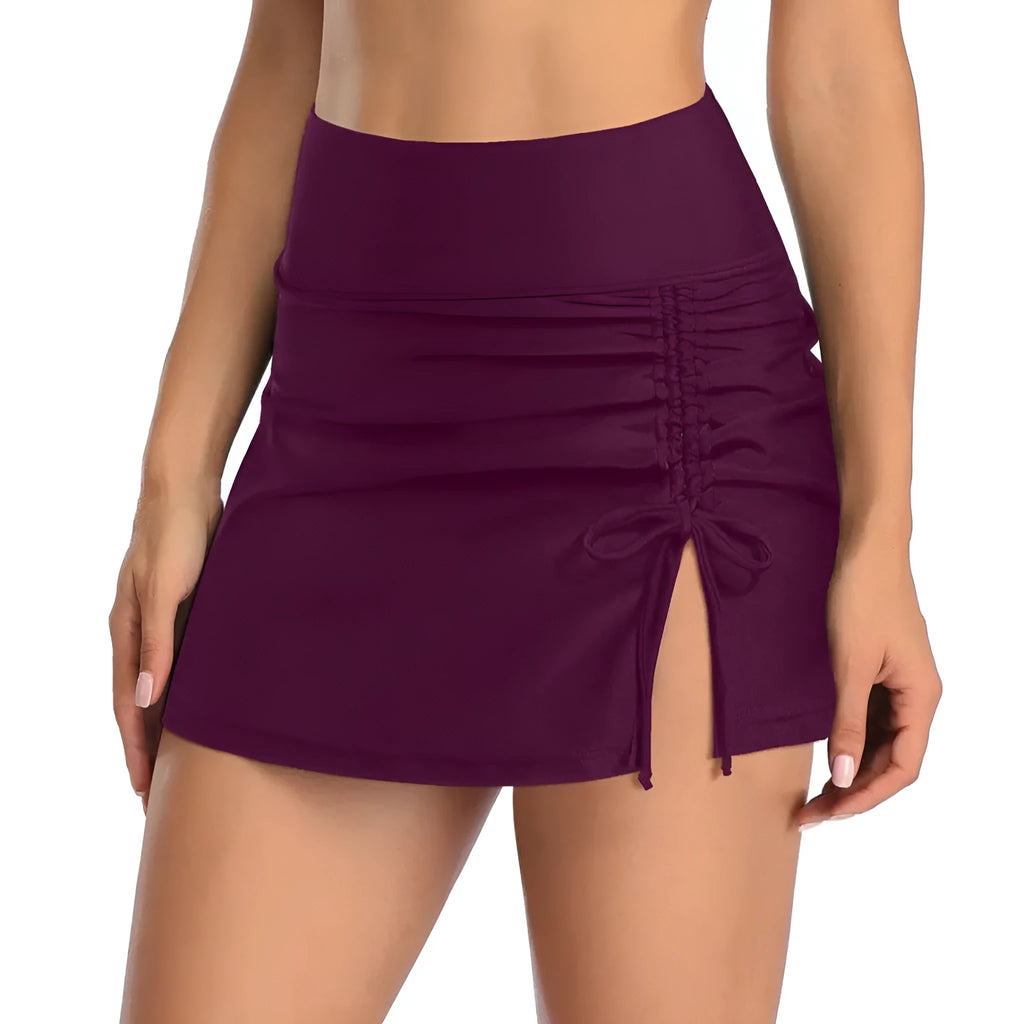 Women's solid colour lace swimming trunks in briefs style, shown in a selection of available colours.
