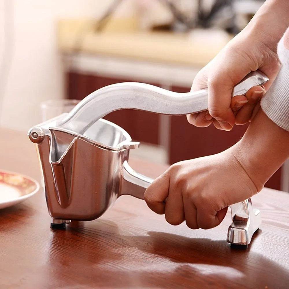 Silver heavy duty aluminium alloy lemon squeezer with large bowl on countertop