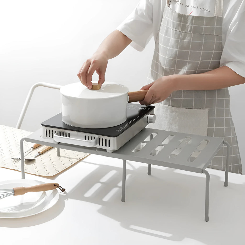 White telescopic plastic kitchen rack at extended height with ground installation