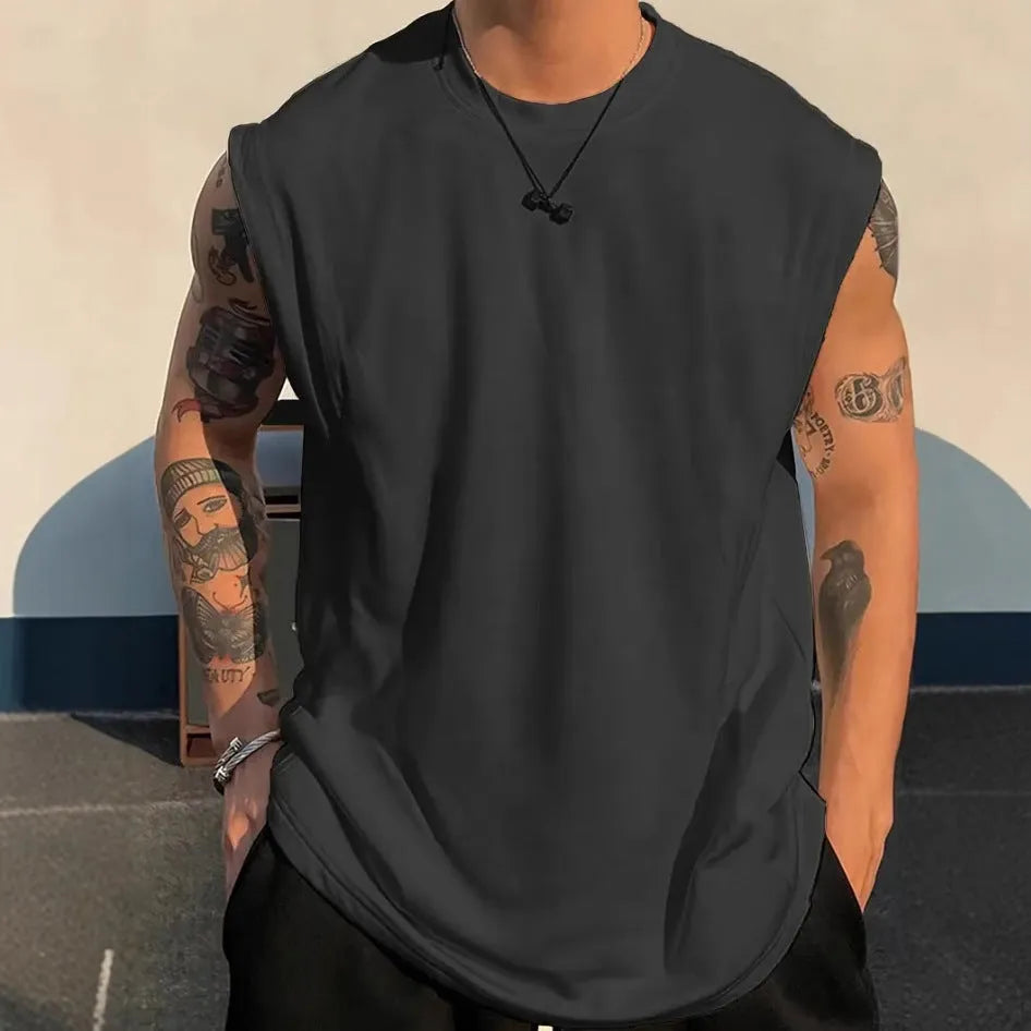 Men's loose solid colour cotton tank top t-shirt on a hanger, showing straight hem and sleeveless design.
