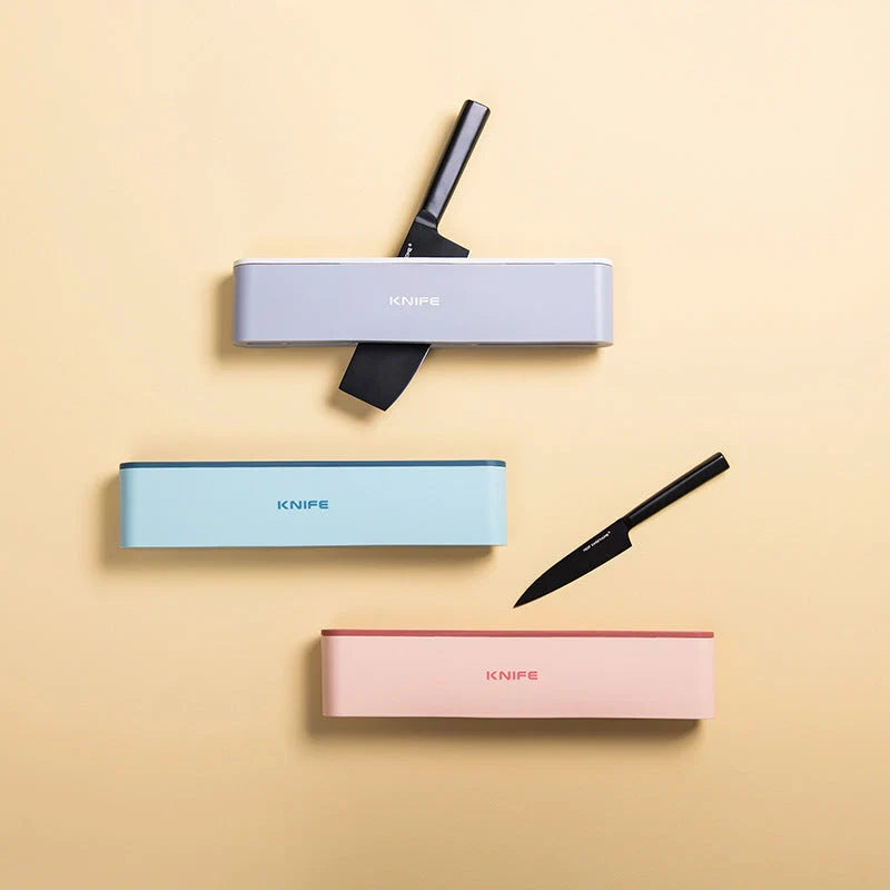 Wall-mounted kitchen knife holder in grey, pink, and light blue