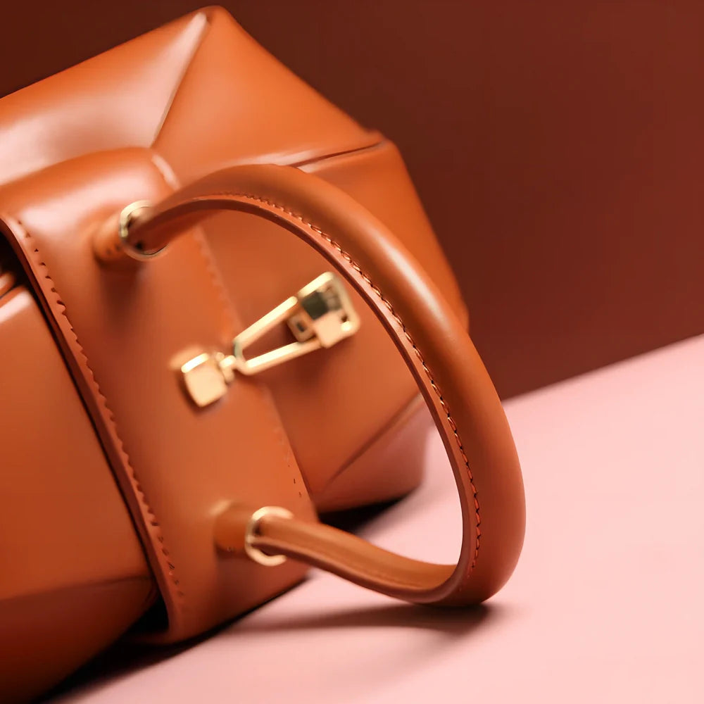 Women's cowhide leather tote bag in tramp shape with single handle and buckle, available in apricot, black, and other colours, big size 35cm x 40cm