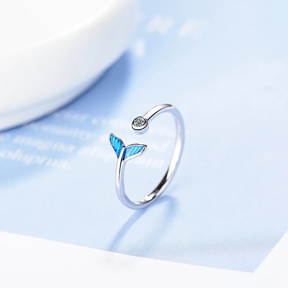 Blue mermaid tail cuff ring with cubic zirconia and epoxy accents, adjustable 17mm, white gold finish