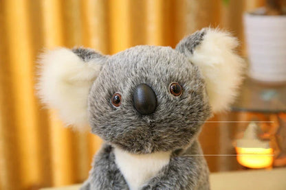 Soft plush koala doll with 100% PP cotton filling, available in 12cm, 16cm, 20cm, and 28cm sizes