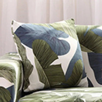 Printed stretchable sofa slipcover covering a three-seater sofa in a modern geometric pattern