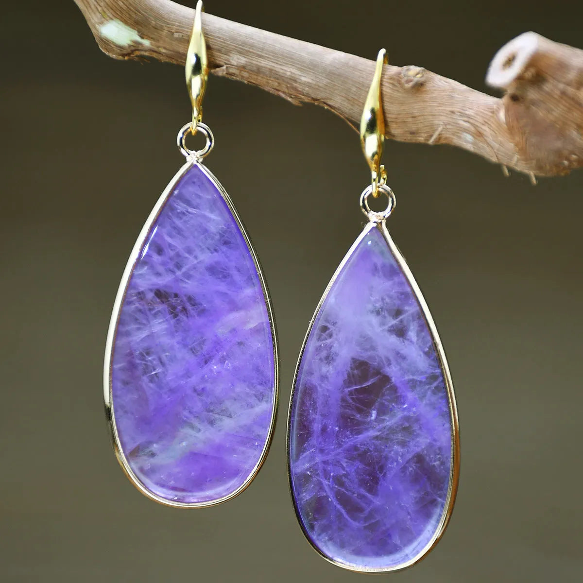 Vintage Tigereye long water drop stone earrings showing textured surface and elongated silhouette