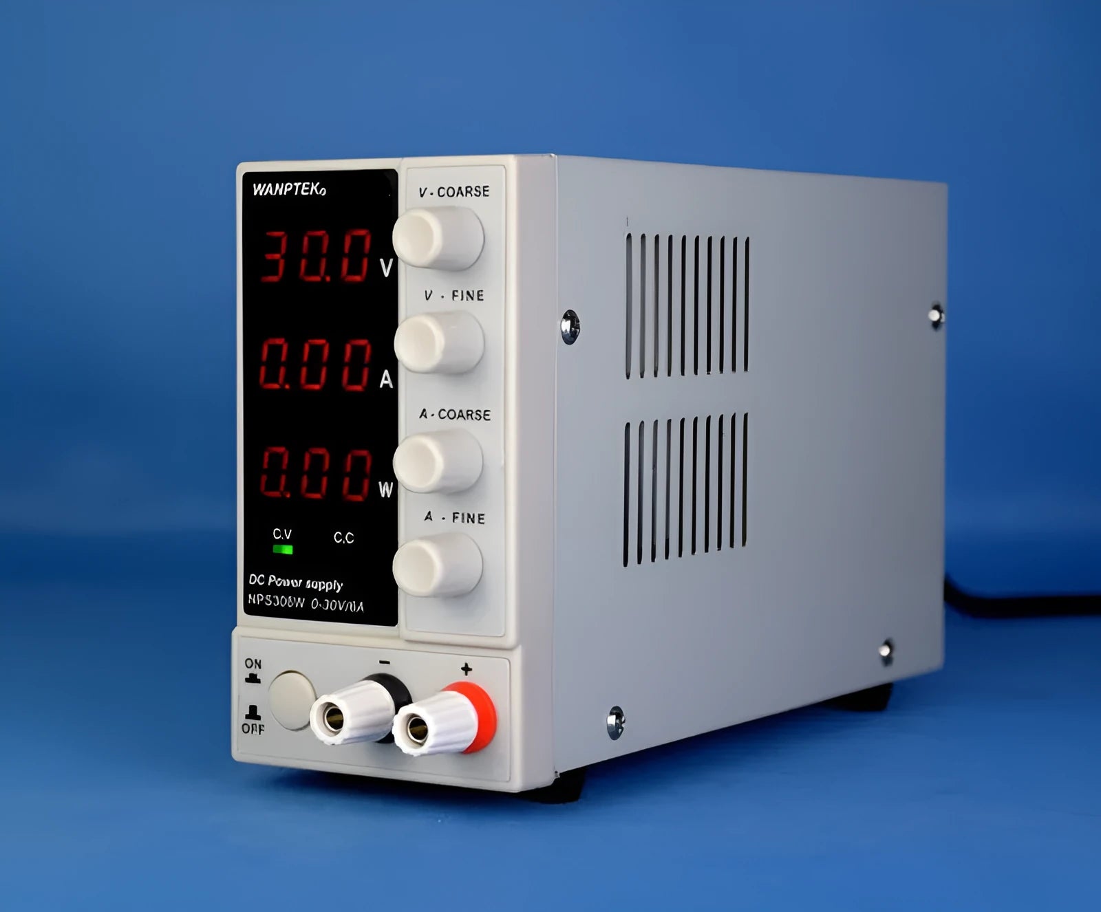 White NPS605W adjustable DC bench power supply with voltage and current dials for electronics repair.