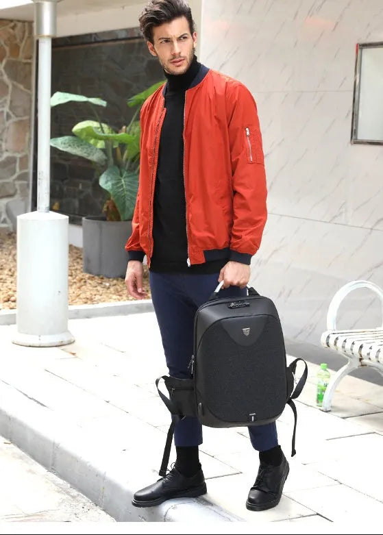 Men's anti-theft cross body shoulder bag for 15.6 inch laptop in black polyester with multiple pockets
