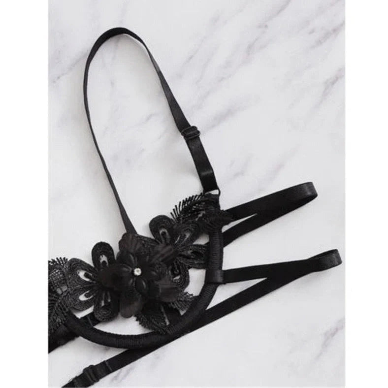 Women's black floral half-cup bra and brief set with fitted straps and back closure