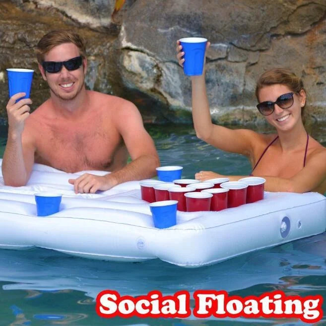 White inflatable beer pong table with built-in cooler floating in pool