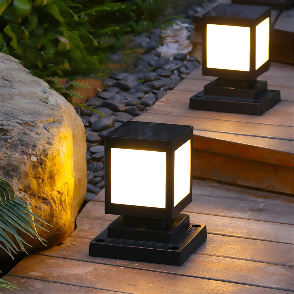 Solar-powered waterproof garden light installed on a lawn post providing white LED illumination.