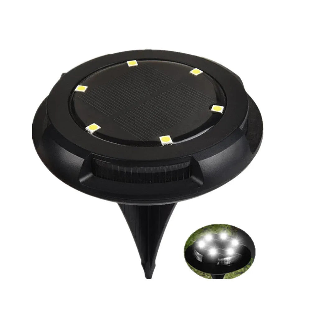 LED solar underground lawn light 11x4x13cm black ABS PP with seven colour changing cold white light on grass at dusk