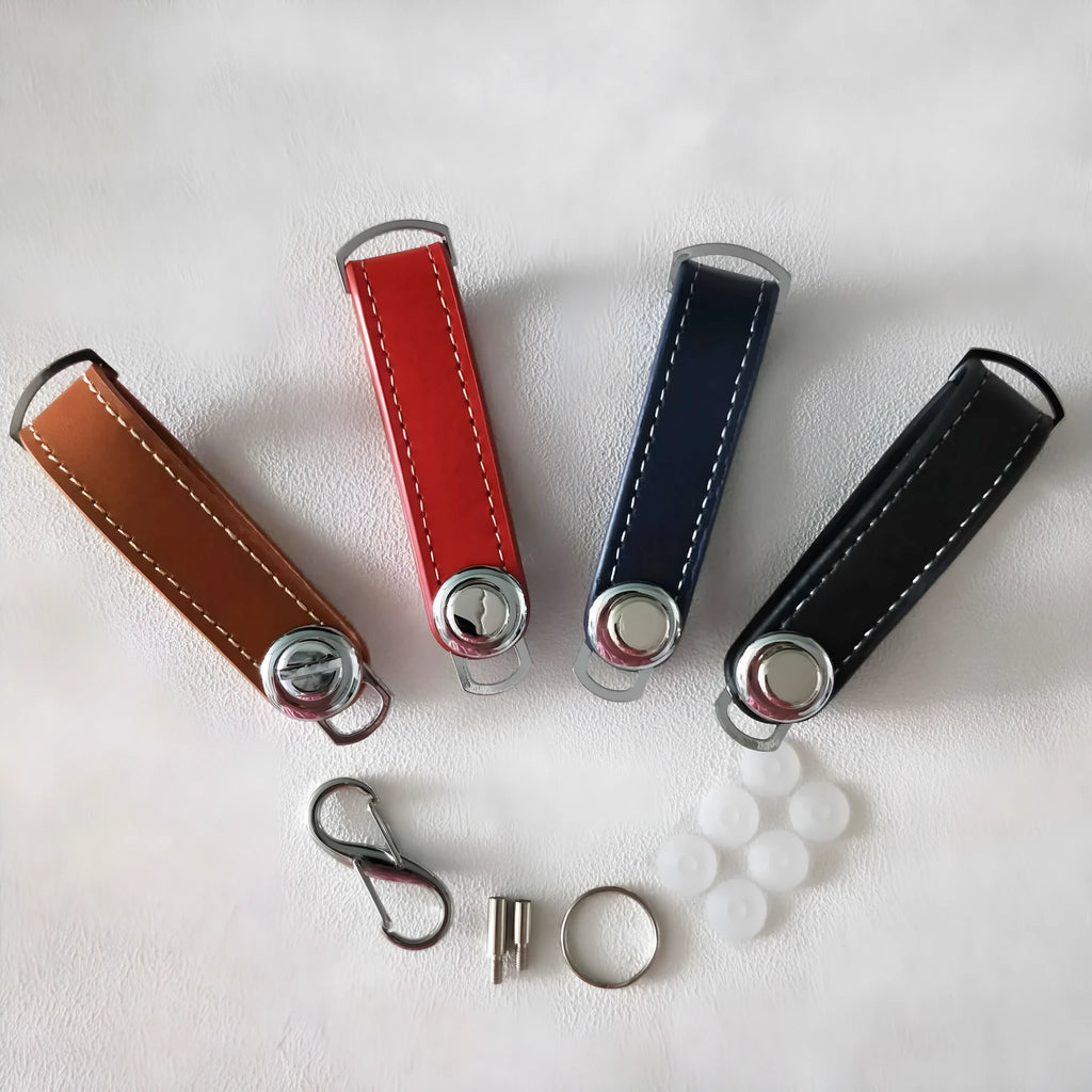 Creative folding key holder in metal copper chrome and cowhide, showing two keyposts and non-slip silicone pad, 85mm length