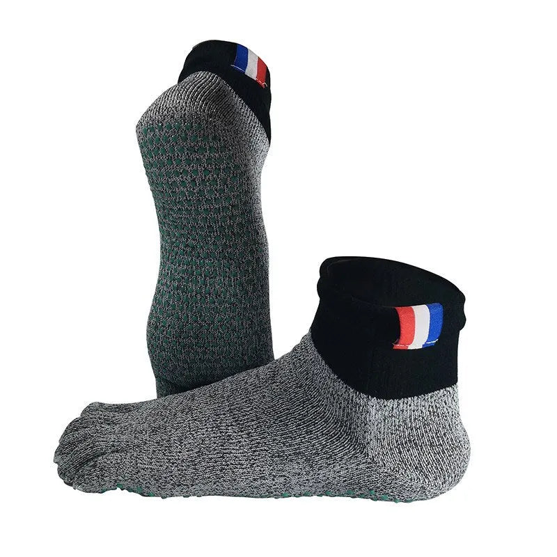 Grey five-toe cut-resistant anti-slip beach socks with non-slip silica gel sole against a neutral background