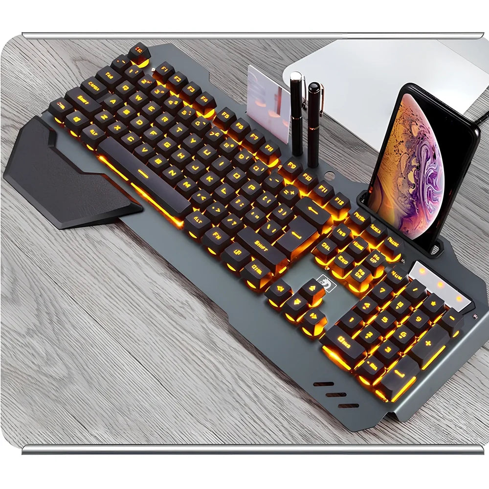 Black wired gaming keyboard with RGB backlight, phone holder, and magnetic wrist rest on desk