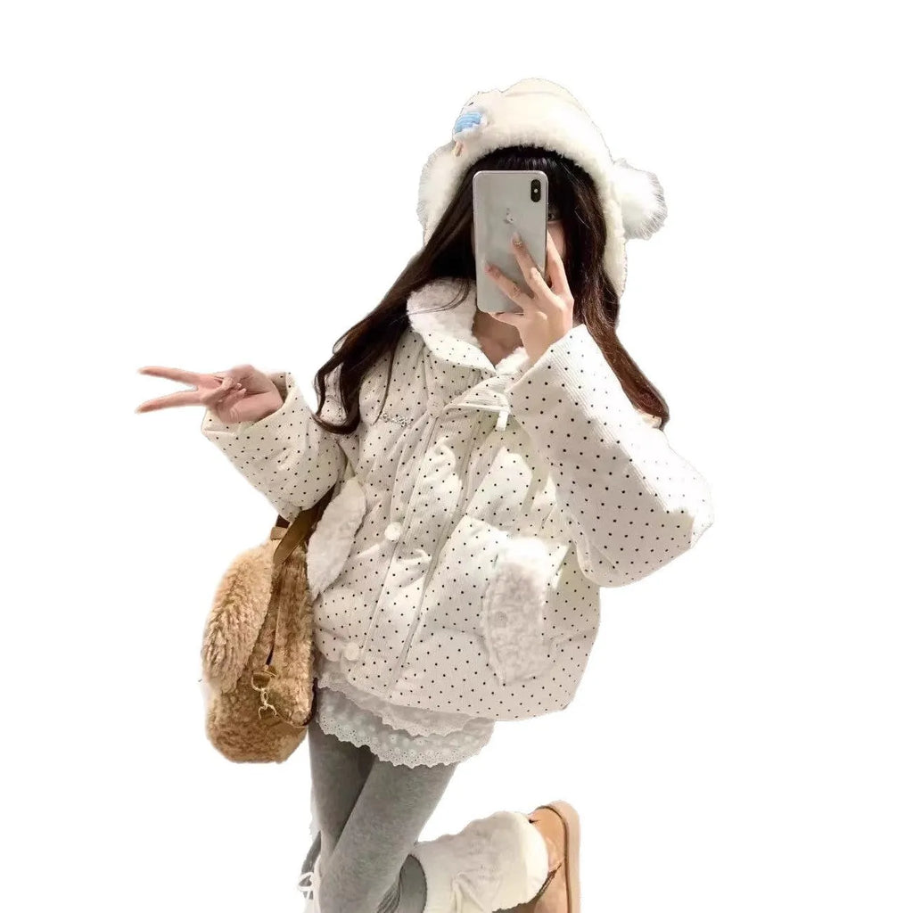 Beige cotton-padded coat with fur collar, dot pattern, and front pockets on a model