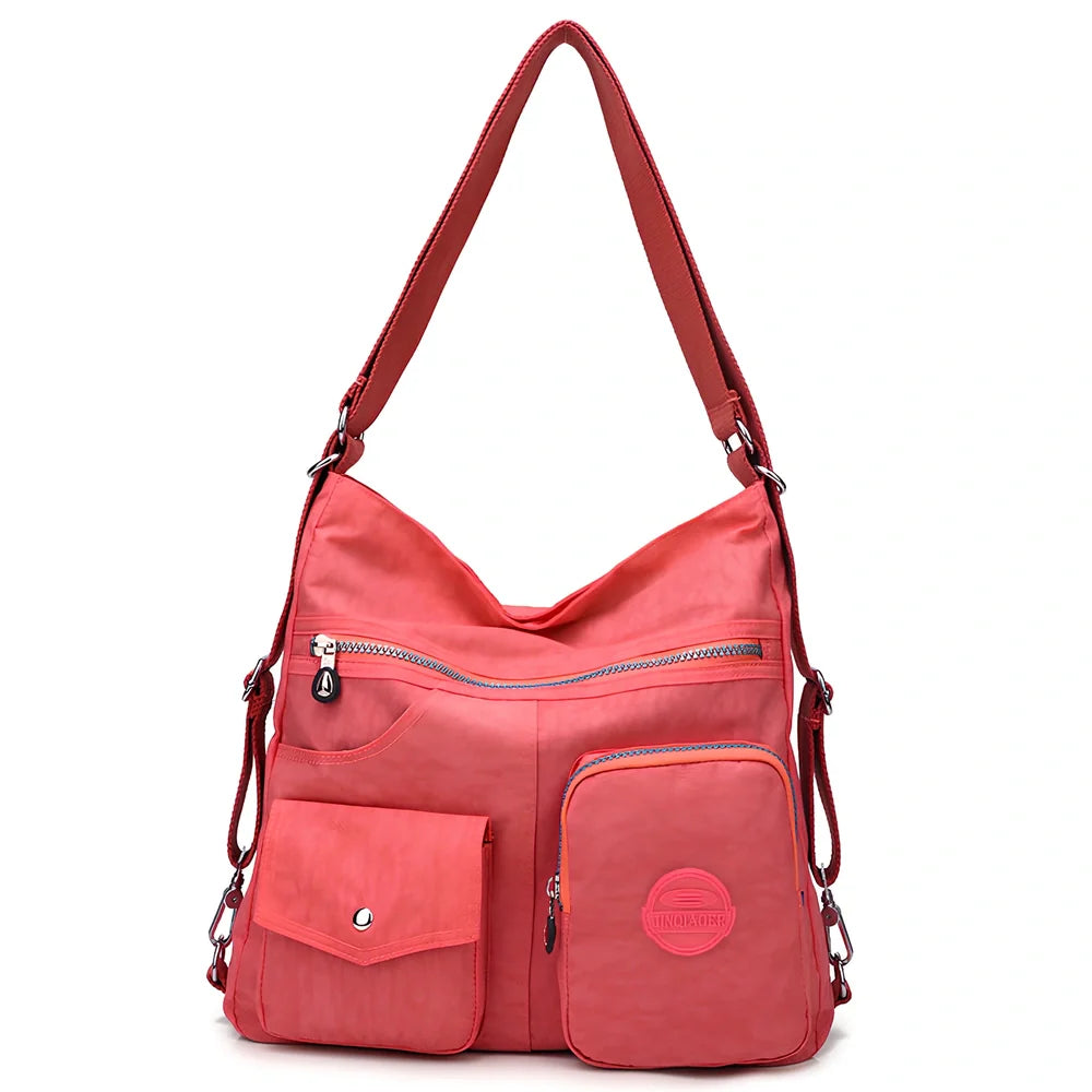 Women's waterproof nylon crossbody bag with organizational pockets and 34cm laptop capacity