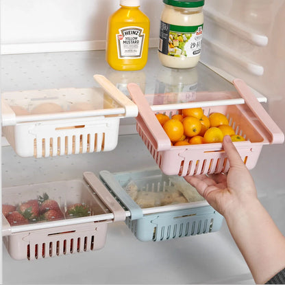 Stretchable refrigerator storage basket in white, blue, pink, and apricot colours