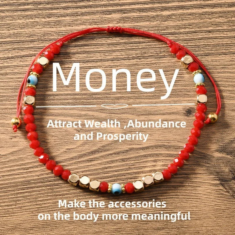 Red hand-woven beaded couple bracelet with artificial crystal eye geometric design on white background