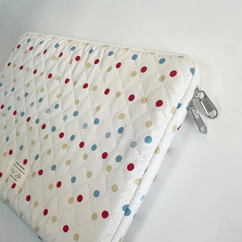 Women's polka dot polyester laptop bag shown in a solid colour, suitable for a 15.6 inch device.
