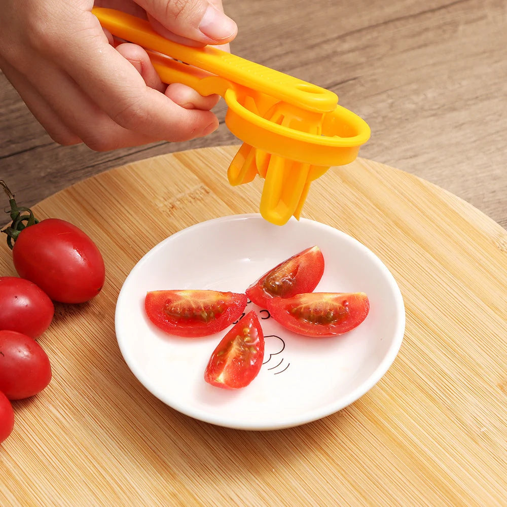 Manual tomato slicer with serrated knife for even dicing, available in red and yellow