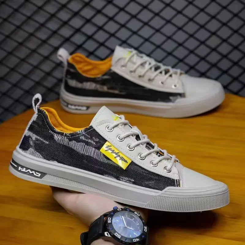 Men's casual canvas lace-up shoes with round toe in black, dark blue, or light blue on a rubber sole.