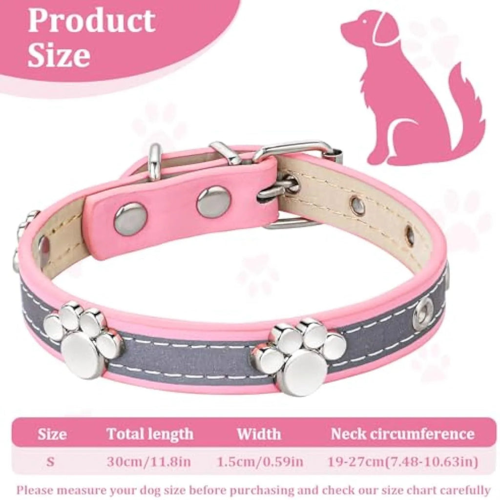 Reflective soft PU leather dog collar with metal buckle and decorative paw print rivets on a grey background.