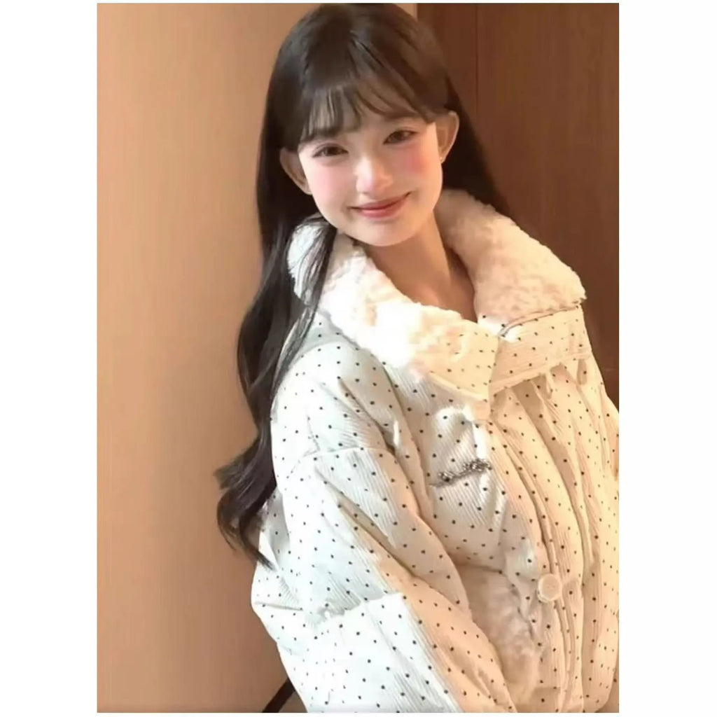 Beige cotton-padded coat with fur collar, dot pattern, and front pockets on a model