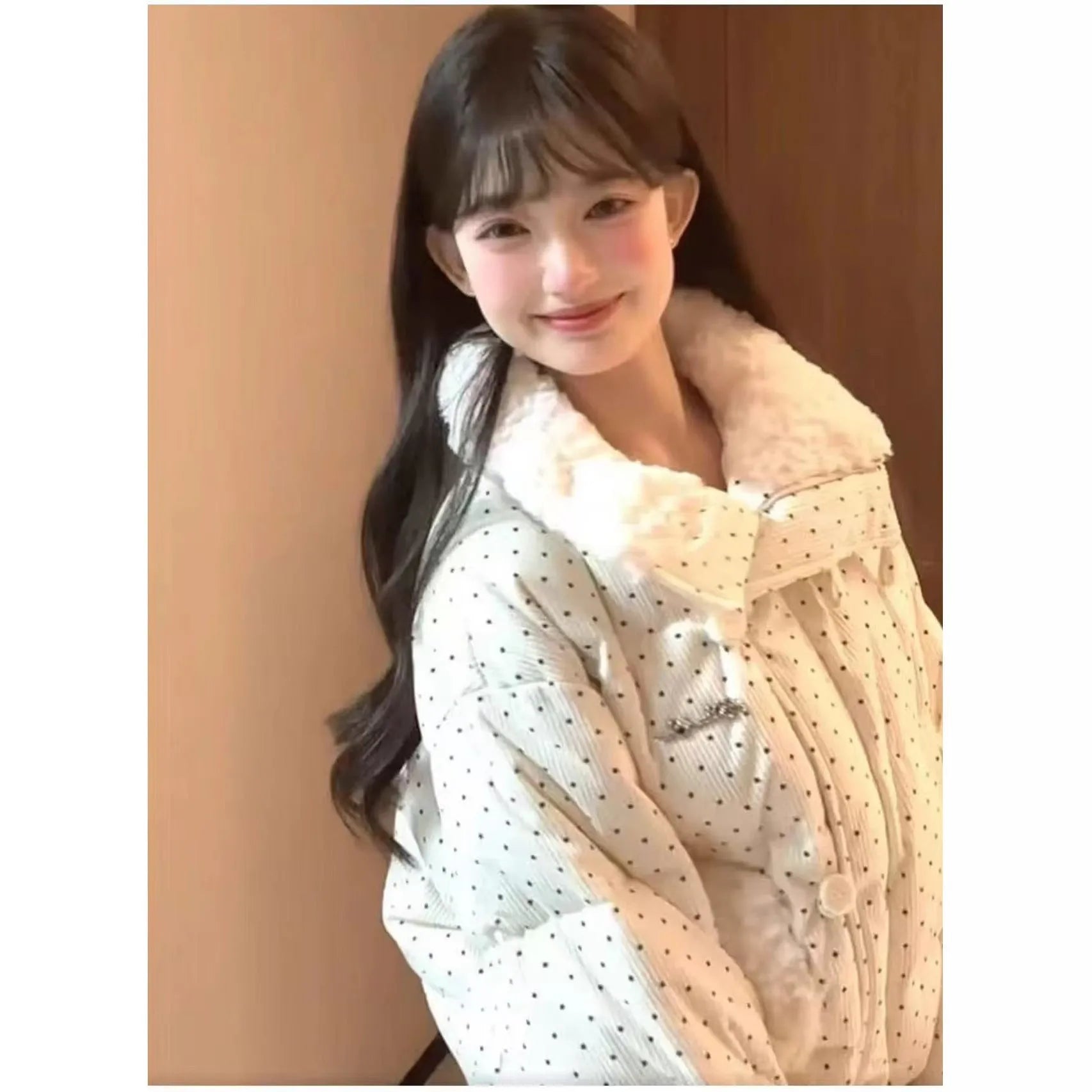 Beige cotton-padded coat with fur collar, dot pattern, and front pockets on a model