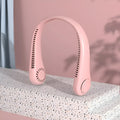 A pink portable bladeless neck fan with a soft neckband, shown being worn.
