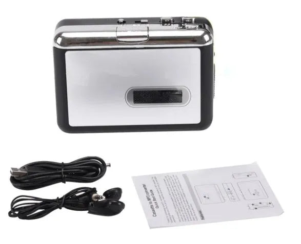 White USB Cassette to MP3 Converter with earphone and USB cable on desk