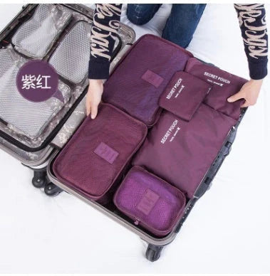 Durable waterproof packing cubes in various colors for organized, efficient travel