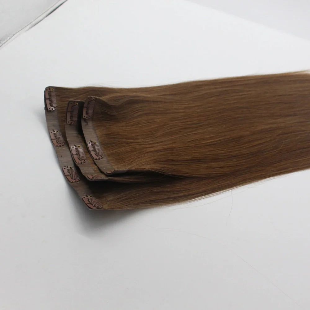 Clip-in human hair extensions in various lengths from 10 to 30 inches with secure attachment clips