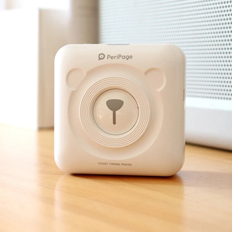 Portable handheld label mini thermal printer in white, pink, or blue
