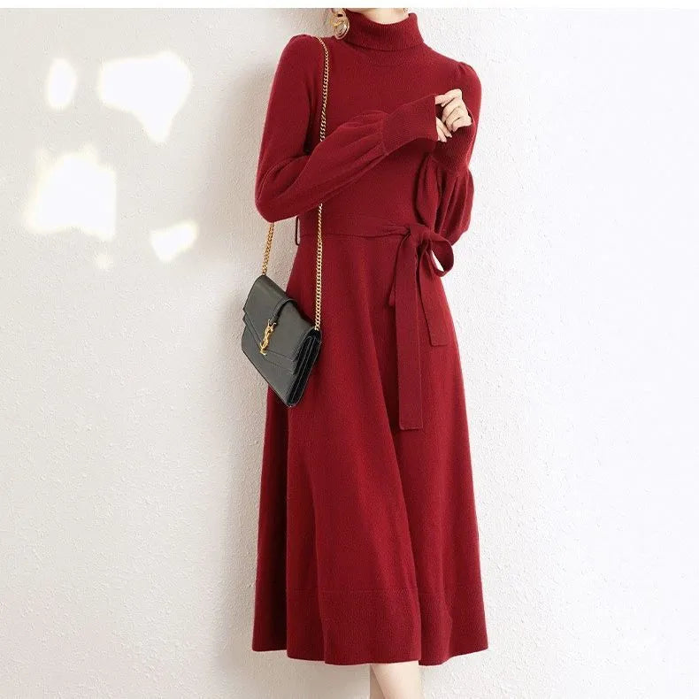 Women's turtleneck knit dress in rose red with long sleeves, loose hem, and elastic waist.