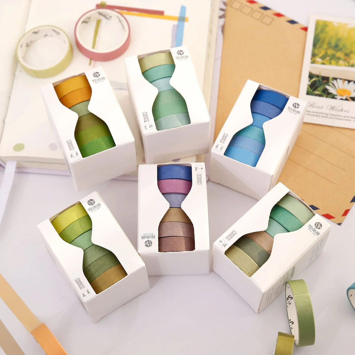 Morandi Japanese paper tape six rolls 9mm x 3m in assorted colours on craft background