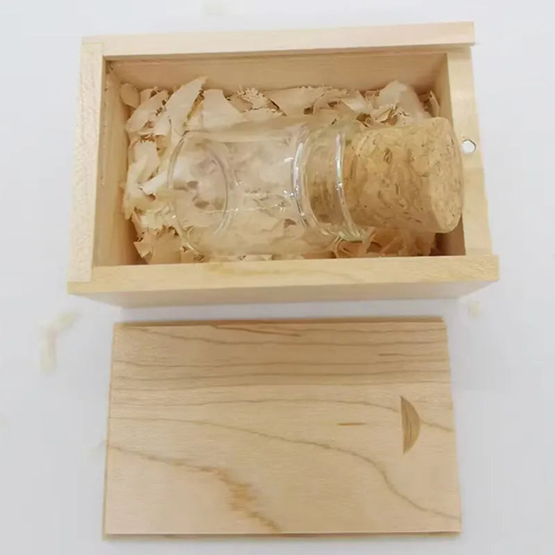 Transparent plastic bottle-shaped USB flash drive with a wooden ship model inside.