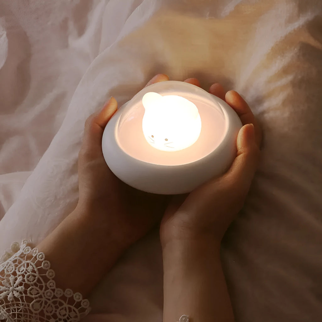USB LED night light with touch control, blue colour, compact 12x12x6.5cm size on bedside table