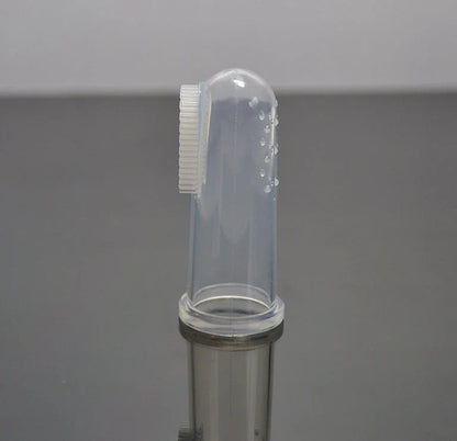 Silicone pet toothbrush set in white color, with finger-fit design for easy use and soft bristles for gentle cleaning of cats' and dogs' teeth.